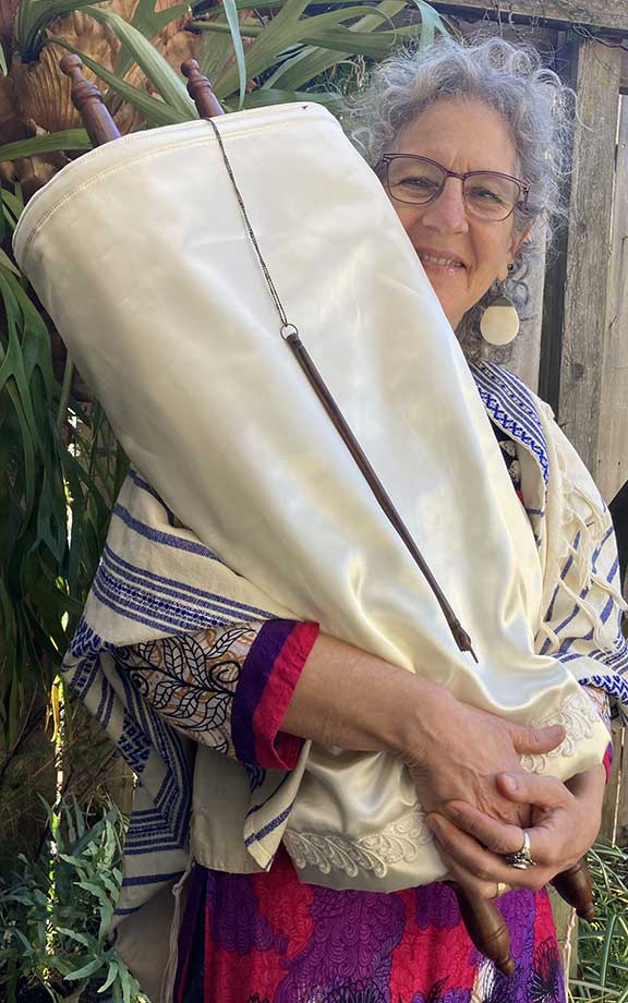 Chaya holding a Torah